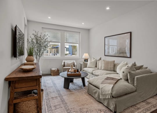 a living room with a couch and a tableat Westbury Apartments, Rancho Cucamonga, 91739