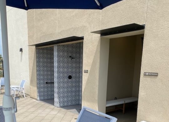 a patio with a table and chairs and an umbrellaat Westbury Apartments, Rancho Cucamonga, 91739
