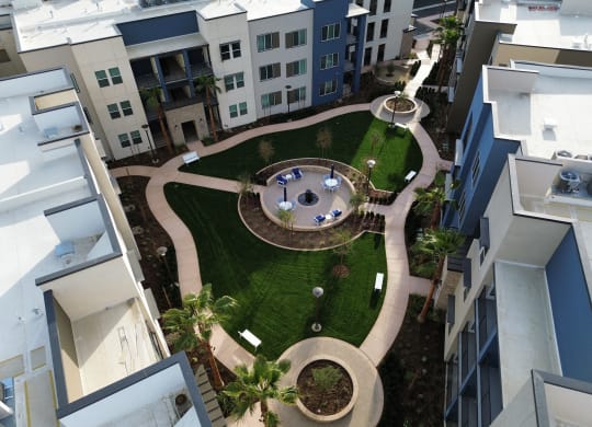 an aerial view of the courtyard of an apartment building with a lawn  at Westbury Apartments, Rancho Cucamonga, 91739