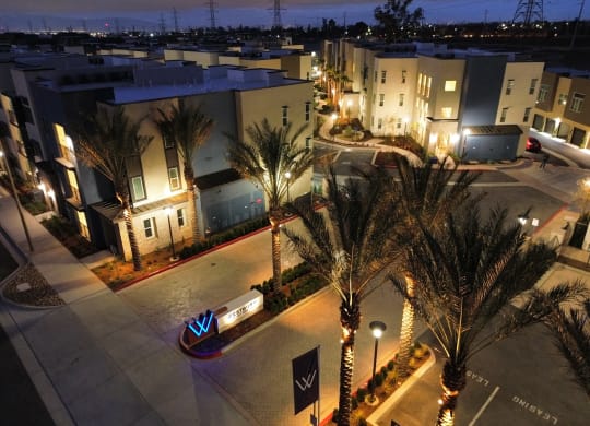 an aerial view of a street with apartments at night  at Westbury Apartments, Rancho Cucamonga, CA