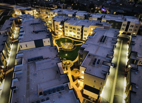 a city at night with buildings and a fountainat Westbury Apartments, Rancho Cucamonga, CA, 91739