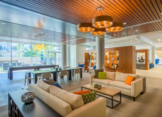 a living room with couches and a table in a lobby at The Metropolitan Downtown Columbia, Columbia, Maryland