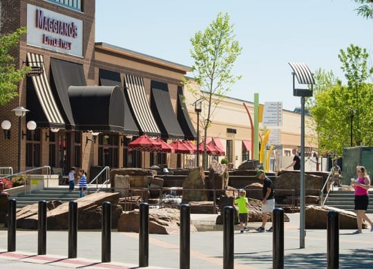 a city street with an exhibit of rocks in front of a building at The Metropolitan Downtown Columbia, Maryland