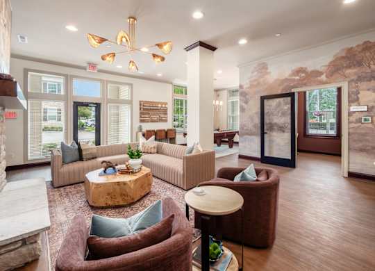 A living room with a brown couch and a wooden coffee table.