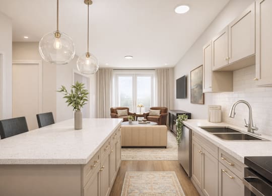 A modern kitchen with a large island and pendant lights.
