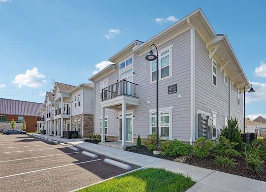 A row of houses with a clear blue sky above them.