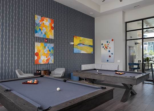 A pool table with a white ball on it.