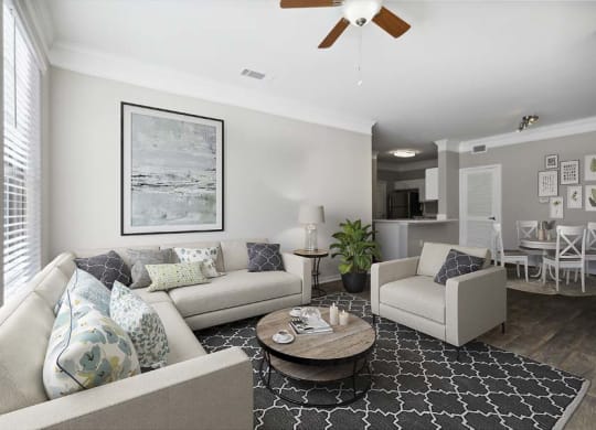 a living room filled with furniture and a ceiling fan