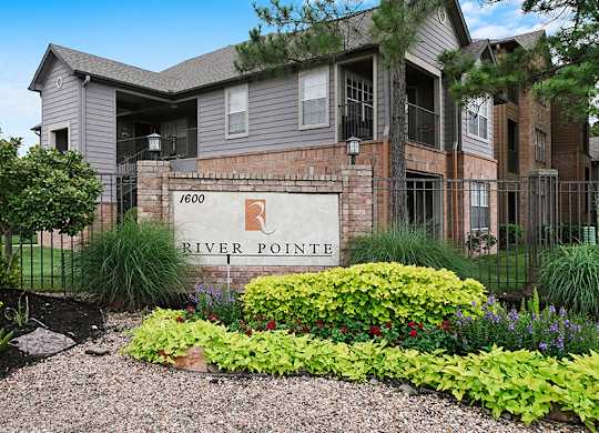 The front of a building with a sign that says River Pointe.