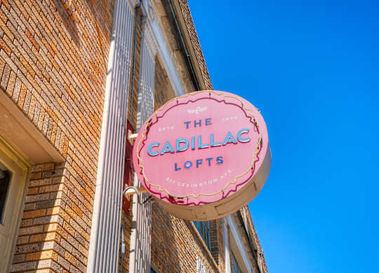 A pink sign that says