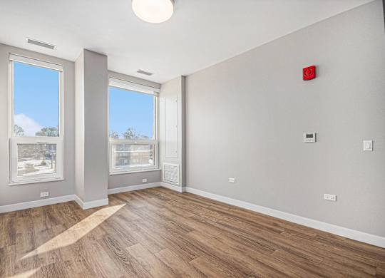 Room with a red fire alarm at Thrive Exchange, Chicago, 60617