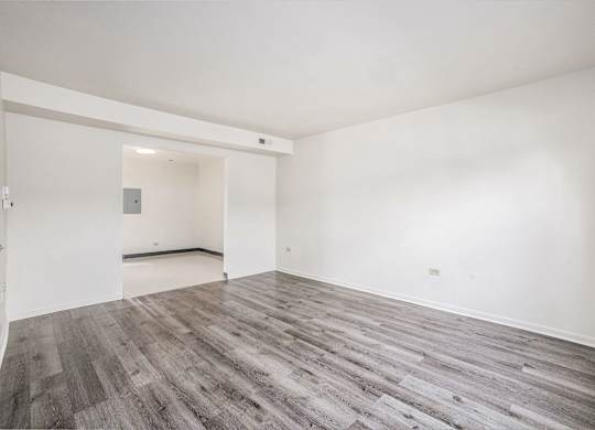 A room with a grey floor and white walls.