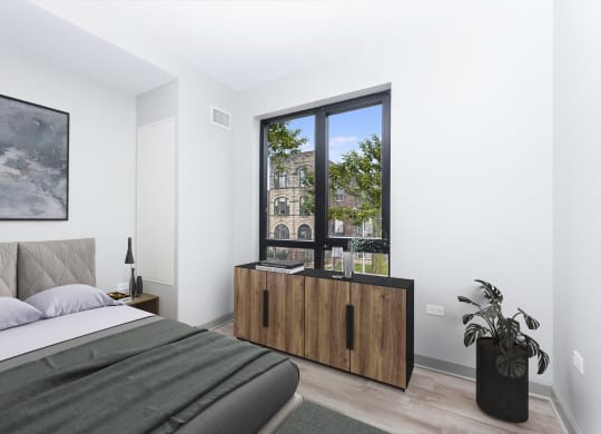 a bedroom with a bed and a large window