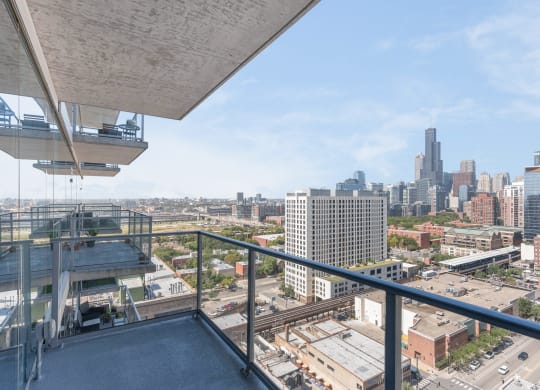 a balcony with a view of a city and a skyscraper at One 333, Illinois, 60605