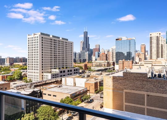 a view of the city from a balcony on a sunny day at One 333, Chicago, IL, 60605