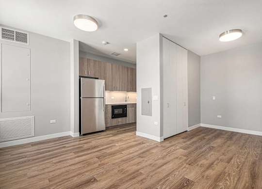 Kitchen with a refrigerator, oven, and microwave at Thrive Exchange, Chicago, 60617