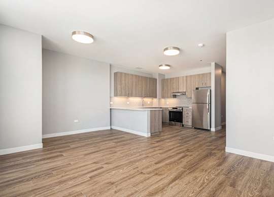 Kitchen with a refrigerator, sink, and cabinets at Thrive Exchange, Illinois