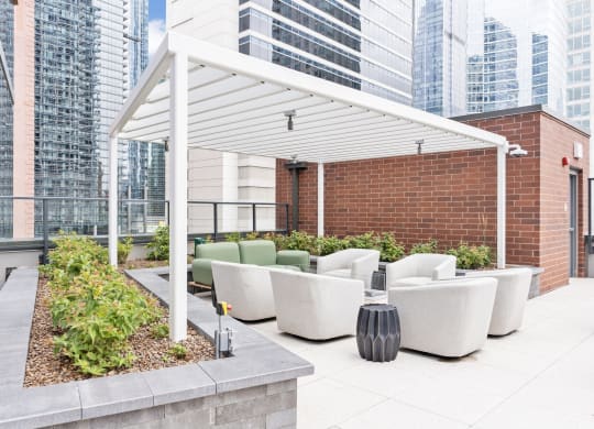 a terrace with couches and chairs and a white canopy  at Cassidy on Canal, Illinois, 60606