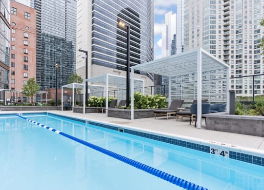 a swimming pool with skyscrapers in the background  at Cassidy on Canal, Chicago, IL, 60606