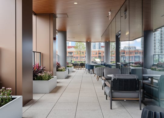 a large terrace with tables and chairs and a view of the city  at Cassidy on Canal, Chicago, Illinois