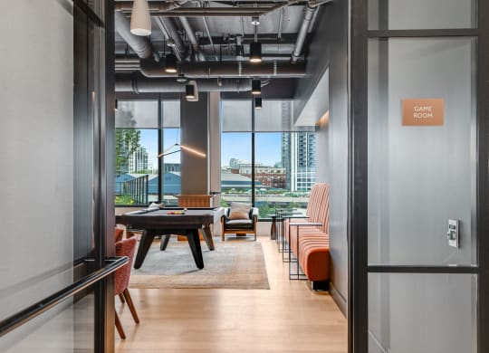 a conference room with a table and chairs and a view of the city  at Cassidy on Canal, Chicago, Illinois