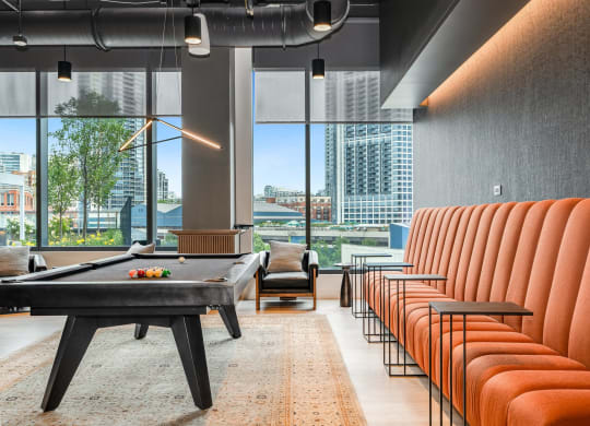 a living room with a pool table and chairs  at Cassidy on Canal, Illinois