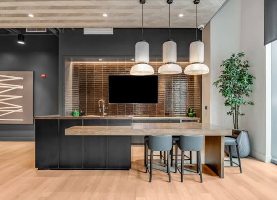 a kitchen with a large island and a table with chairs  at Cassidy on Canal, Chicago