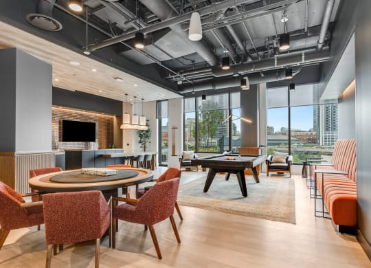 a lounge area with tables and chairs and a pool table  at Cassidy on Canal, Chicago