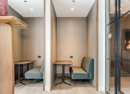 a waiting room with two chairs and a table at Cassidy on Canal, Chicago, IL, 60654
