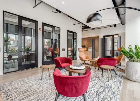 a living room with red chairs and a table  at Cassidy on Canal, Chicago, Illinois