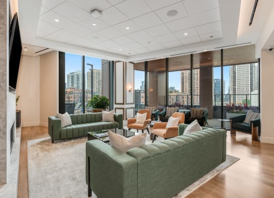 a living room with couches and chairs in front of windows  at Cassidy on Canal, Chicago