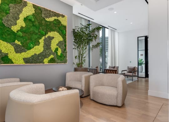 a living room with couches and chairs and a large artwork on the wall  at Cassidy on Canal, Chicago, Illinois