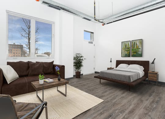 a living room with a couch and a bed