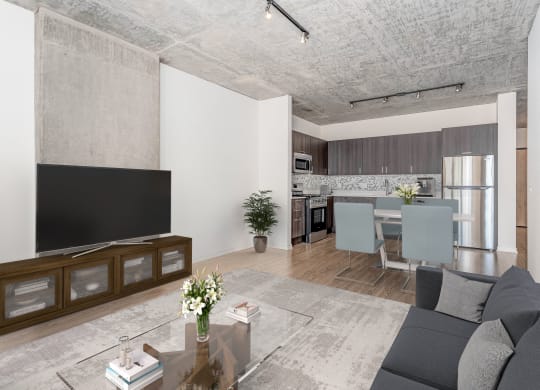 a living room and dining room with a couch and a tv at One 333, Chicago, IL, 60605
