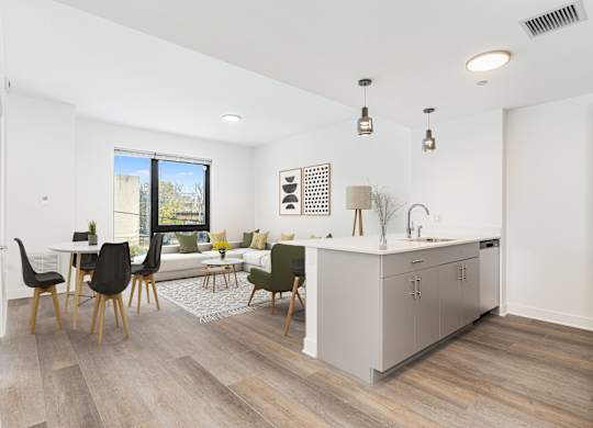A modern kitchen with a dining table and chairs.