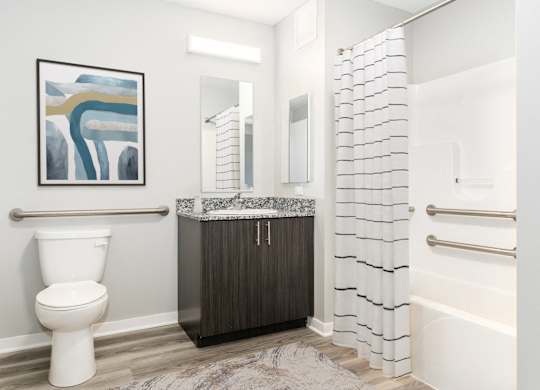 a bathroom with a toilet and a shower and a sink