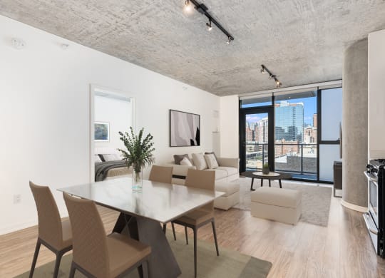 a living room with a table and chairs and a couch at One 333, Chicago, Illinois, 60605