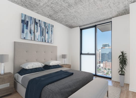 a bedroom with a bed and a large window at One 333, Chicago, Illinois, 60605