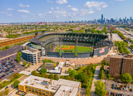 an aerial view of fenway park with the chicago skyline in the background