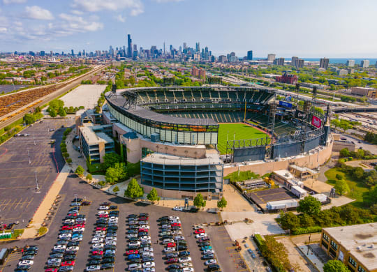 an aerial view of the stadium with the chicago skyline in the background