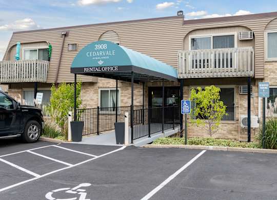 Rental office entrance with covered walkway at Cedarvale Highlands Apartments, Eagan, 55122