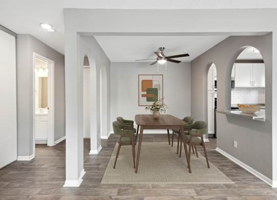 Dining room with wood table and green chairs at Cedarvale Highlands Apartments, Eagan, Minnesota