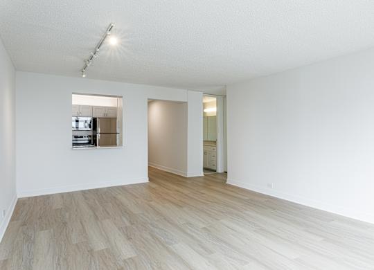 A room with wooden flooring and a mirror on the wall at Columbus Plaza, Chicago, Illinois