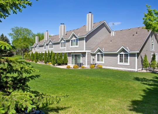 a large house with a lawn in front of it at Seasons Villas, Minnesota