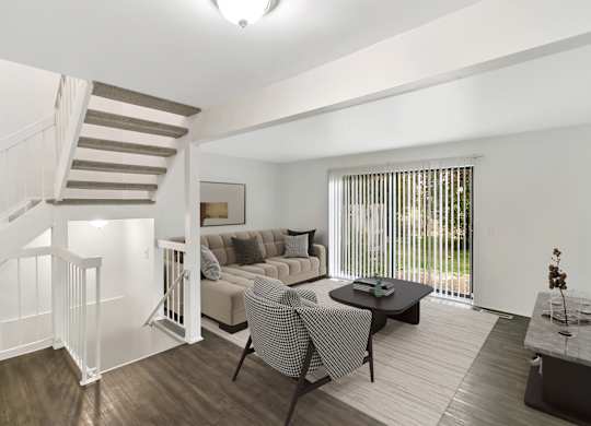 Living Room With Loft View at The Village of Hyde Park, Detroit, MI