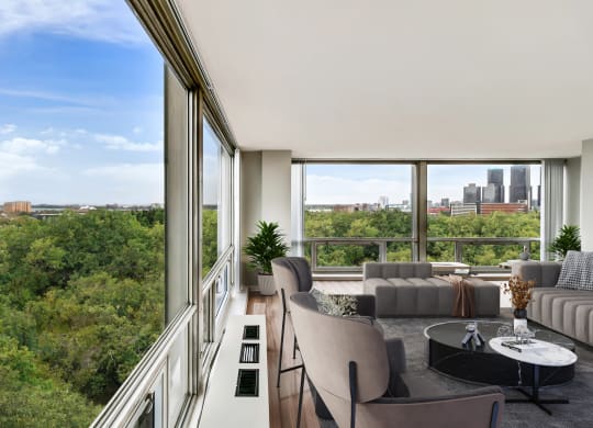 a living room with a large window and a view of the city at The Pavilion, Detroit, MI