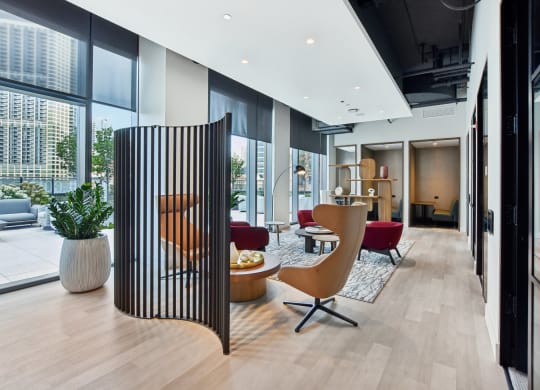 a living room with a large window and a wooden divider at Cassidy on Canal, Chicago