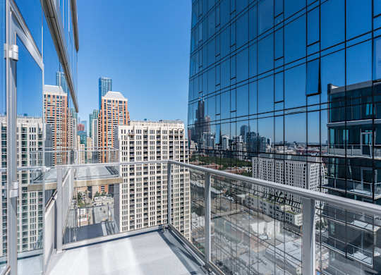 A view from a high-rise building looking out over a cityscape.