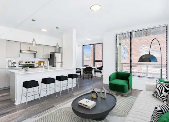 a living room with a kitchen and a dining room