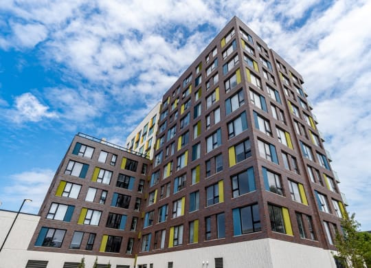 a tall building with a blue sky in the background